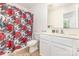 Well-lit bathroom with white vanity and decorative shower curtain at 8005 Stevie Oaks Ln, Charlotte, NC 28215