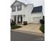 Charming two-story home with a garage, neat landscaping and a well-maintained lawn at 8005 Stevie Oaks Ln, Charlotte, NC 28215