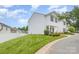Charming two-story home with a well-manicured lawn and an adjacent home at 8005 Stevie Oaks Ln, Charlotte, NC 28215