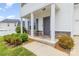 Inviting front porch with stone accents and a convenient seating area near the entrance at 8005 Stevie Oaks Ln, Charlotte, NC 28215