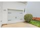 Attached two-car garage with white door at 8005 Stevie Oaks Ln, Charlotte, NC 28215