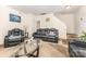 Inviting living room featuring stylish leather sofas and a glass-top center table at 8005 Stevie Oaks Ln, Charlotte, NC 28215