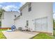 A view of the home's patio with chairs and a sliding glass door at 8005 Stevie Oaks Ln, Charlotte, NC 28215