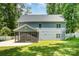 The backyard provides a screened sunroom, an open backyard, and a fenced perimeter at 8418 Knollwood Cir, Charlotte, NC 28213