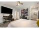 Bedroom with decorative tapestry, ceiling fan, keyboard, and computer work station at 8418 Knollwood Cir, Charlotte, NC 28213