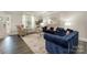Sophisticated living room featuring modern furniture, hardwood floors, and neutral decor at 8418 Knollwood Cir, Charlotte, NC 28213