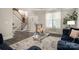 Cozy living room featuring hardwood floors, a decorative rug, and ample natural light at 8418 Knollwood Cir, Charlotte, NC 28213