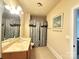 A secondary bathroom with vanity and shower-tub combo at 8620 Rolling Fields Rd, Charlotte, NC 28227