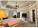 Spacious bedroom features neutral paint, plush carpet, and access to an en-suite bathroom at 8620 Rolling Fields Rd, Charlotte, NC 28227