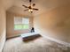 Bedroom with neutral walls, ceiling fan, and window at 8620 Rolling Fields Rd, Charlotte, NC 28227