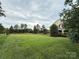 Spacious front yard with a view of the house's facade at 8620 Rolling Fields Rd, Charlotte, NC 28227