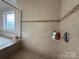 Close up of tiled shower and shower fixtures at 8620 Rolling Fields Rd, Charlotte, NC 28227