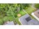 An aerial shot shows the green backyard with white fence and well manicured flowerbeds at 9210 Ginhouse Ln, Charlotte, NC 28277