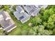 Aerial view of light green home and spacious backyard with white picket fence at 9210 Ginhouse Ln, Charlotte, NC 28277