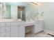Bright bathroom featuring double sinks, vanity, and a glass-enclosed shower at 9210 Ginhouse Ln, Charlotte, NC 28277