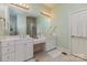 Bathroom features double sinks, a walk-in shower, and white cabinetry at 9210 Ginhouse Ln, Charlotte, NC 28277