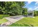 The Bocce ball court is a central feature with an accompanying shelter, surrounded by lush greenery and well-maintained lawns at 9210 Ginhouse Ln, Charlotte, NC 28277