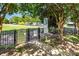 Entrance to a private community park featuring lush greenery, walking paths, and a tranquil environment for residents to enjoy at 9210 Ginhouse Ln, Charlotte, NC 28277