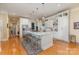Spacious kitchen with a large island, stainless steel appliances, and ample cabinet space at 9210 Ginhouse Ln, Charlotte, NC 28277