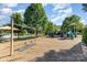 A vibrant playground with swings, slides, and climbing structures at 9210 Ginhouse Ln, Charlotte, NC 28277
