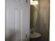 Half bathroom featuring oval mirror and white sink at 10726 Greenhead View Rd, Charlotte, NC 28262