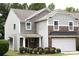 Charming two-story home with stone accents, neutral siding, and a well-maintained front yard at 10726 Greenhead View Rd, Charlotte, NC 28262