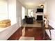 Cozy living room with a fireplace, neutral paint, and hardwood flooring throughout at 10726 Greenhead View Rd, Charlotte, NC 28262