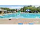 Large community pool with comfortable loungers and a fun water slide at 10726 Greenhead View Rd, Charlotte, NC 28262