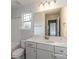 Clean bathroom features a white vanity, a large mirror, and ample natural light at 1090 Gardenia Dr # 5, Mt Ulla, NC 28125