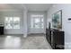 Welcoming foyer with light-colored wood floors, white trim, and ample natural light streaming through windows at 1090 Gardenia Dr # 5, Mt Ulla, NC 28125