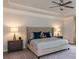 Spacious primary bedroom boasts a tray ceiling, a ceiling fan, and luxurious furnishings at 1090 Gardenia Dr # 5, Mt Ulla, NC 28125
