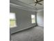 Bright main bedroom featuring windows, crown moulding, and a neutral color scheme at 1110 Gardenia Dr # 6, Mt Ulla, NC 28125