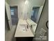 Bright bathroom featuring a double sink vanity with white countertops and modern fixtures at 1130 Gardenia Dr # 7, Mt Ulla, NC 28125