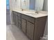 Bathroom featuring a double sink vanity with granite countertops and modern fixtures at 1130 Gardenia Dr # 7, Mt Ulla, NC 28125