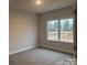 Spacious bedroom with carpet flooring and a window providing natural light at 1130 Gardenia Dr # 7, Mt Ulla, NC 28125