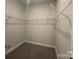 A walk-in closet is equipped with wire shelving for optimal storage at 1130 Gardenia Dr # 7, Mt Ulla, NC 28125