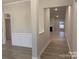 View down the hallway with modern flooring and trim at 1130 Gardenia Dr # 7, Mt Ulla, NC 28125