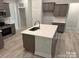 Modern kitchen with a spacious island, stainless steel appliances, and ample cabinet space at 1130 Gardenia Dr # 7, Mt Ulla, NC 28125