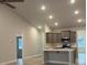 This kitchen features gray cabinets, an island with a light countertop and stainless steel appliances at 1130 Gardenia Dr # 7, Mt Ulla, NC 28125