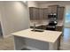 Modern kitchen with a spacious island, stainless steel appliances, and ample cabinet space at 1130 Gardenia Dr # 7, Mt Ulla, NC 28125