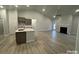 Bright, open-concept living area with vaulted ceiling and cozy fireplace at 1130 Gardenia Dr # 7, Mt Ulla, NC 28125