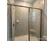Tiled shower with glass doors, built-in seat, and modern fixtures, providing a spa-like experience at 1130 Gardenia Dr # 7, Mt Ulla, NC 28125