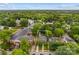 An aerial view shows the property's location, bordered by community buildings and lush greenery at 117 N Mulberry St, Statesville, NC 28677