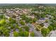 An aerial view of the town, with the home nestled among lush greenery and buildings at 117 N Mulberry St, Statesville, NC 28677