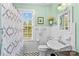 Bright bathroom with a shower and vanity, accented by fresh paint and natural light at 117 N Mulberry St, Statesville, NC 28677