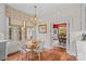 Cozy breakfast nook with seating for four and views into the red painted dining room at 117 N Mulberry St, Statesville, NC 28677
