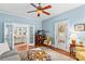 Spacious living room with French doors, hardwood floors, and comfortable furniture at 117 N Mulberry St, Statesville, NC 28677
