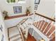 Stairwell features carpeted steps and hardwood landing with picture rail at 117 N Mulberry St, Statesville, NC 28677