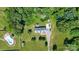 Overhead view shows the home, pool and lush green landscaping of the property at 118 Grain Dr, Stony Point, NC 28678