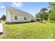Spacious backyard with a lush green lawn and a pergola, perfect for outdoor relaxation and entertaining at 118 Grain Dr, Stony Point, NC 28678